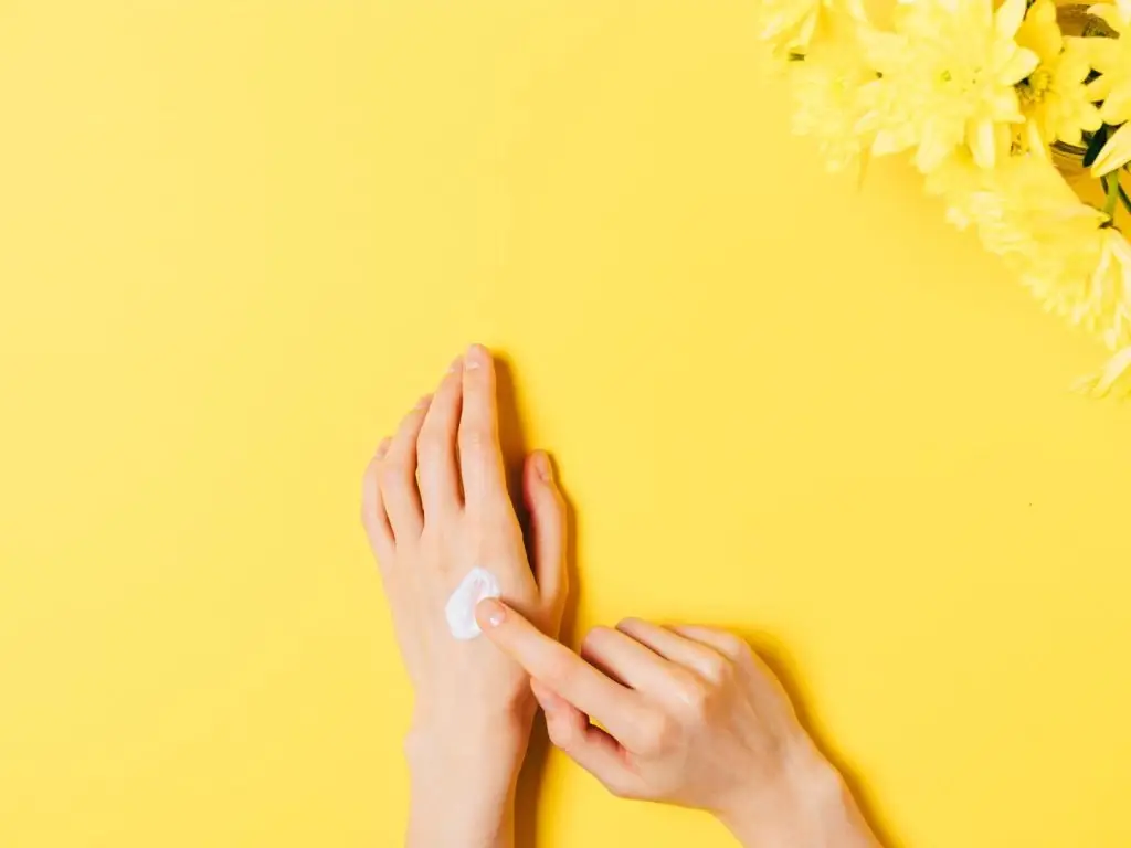 applying cream to hand