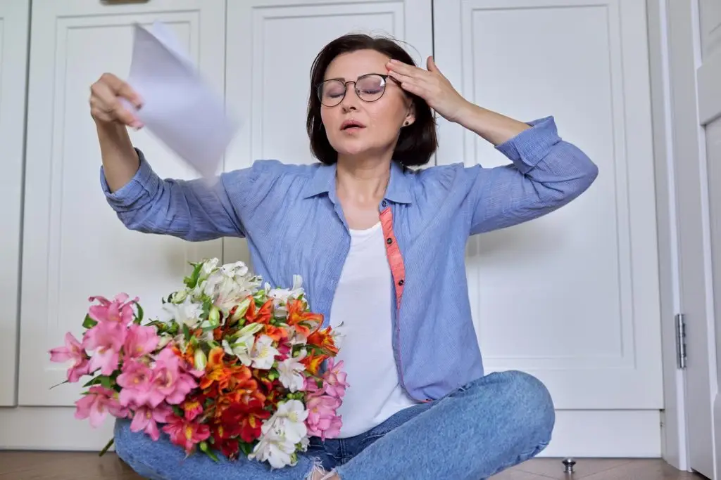 woman experiencing hot flashes