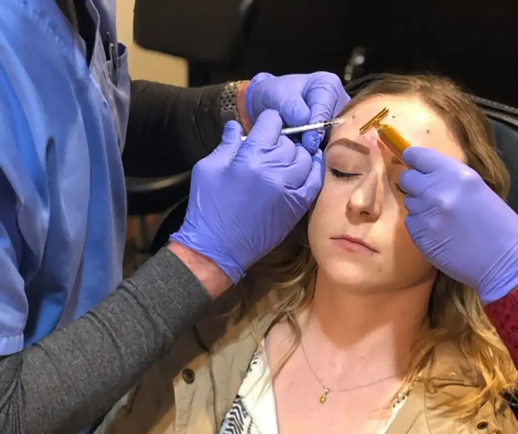 patient getting botox injection at our aesthetic practice